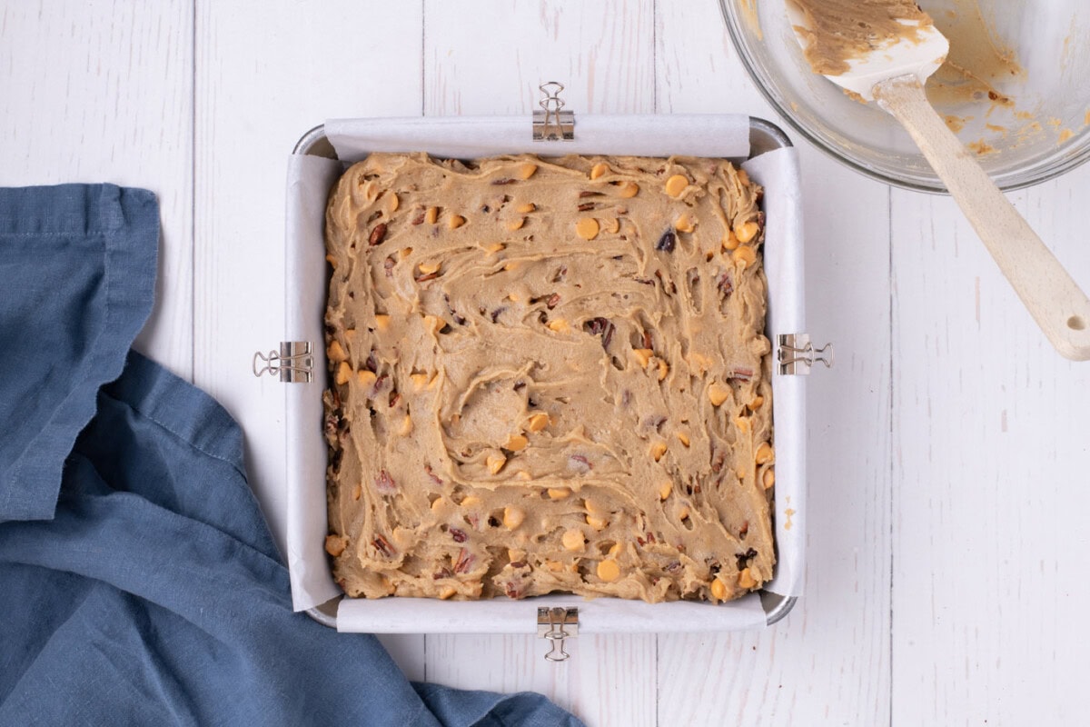 butterscotch brownie batter in a baking pan