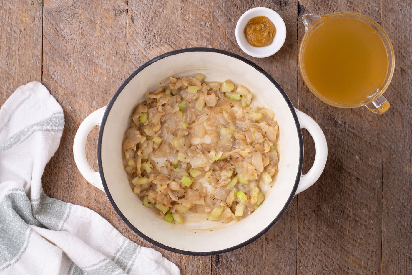 sauteed veggies in a pot thickened with flour