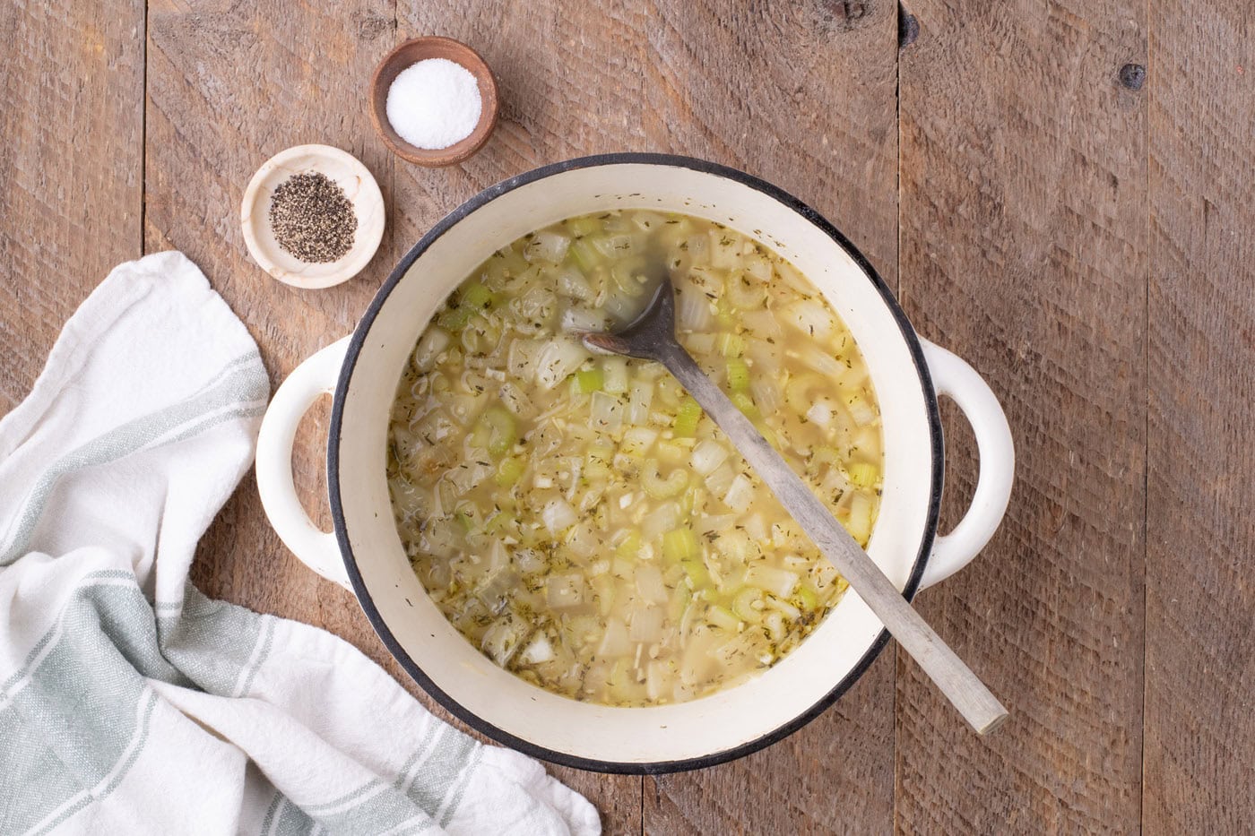 chicken stock added to sauteed veggies in a pot