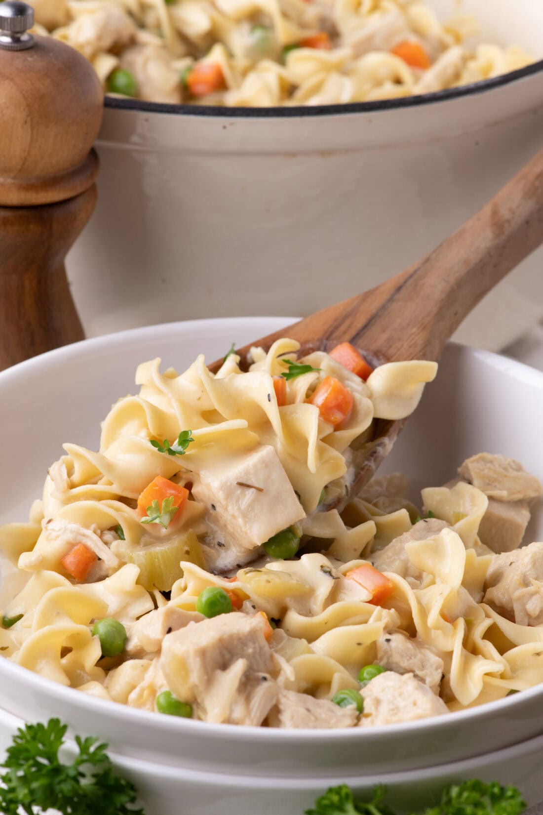 Chicken Pot Pie Pasta being spooned into a bowl