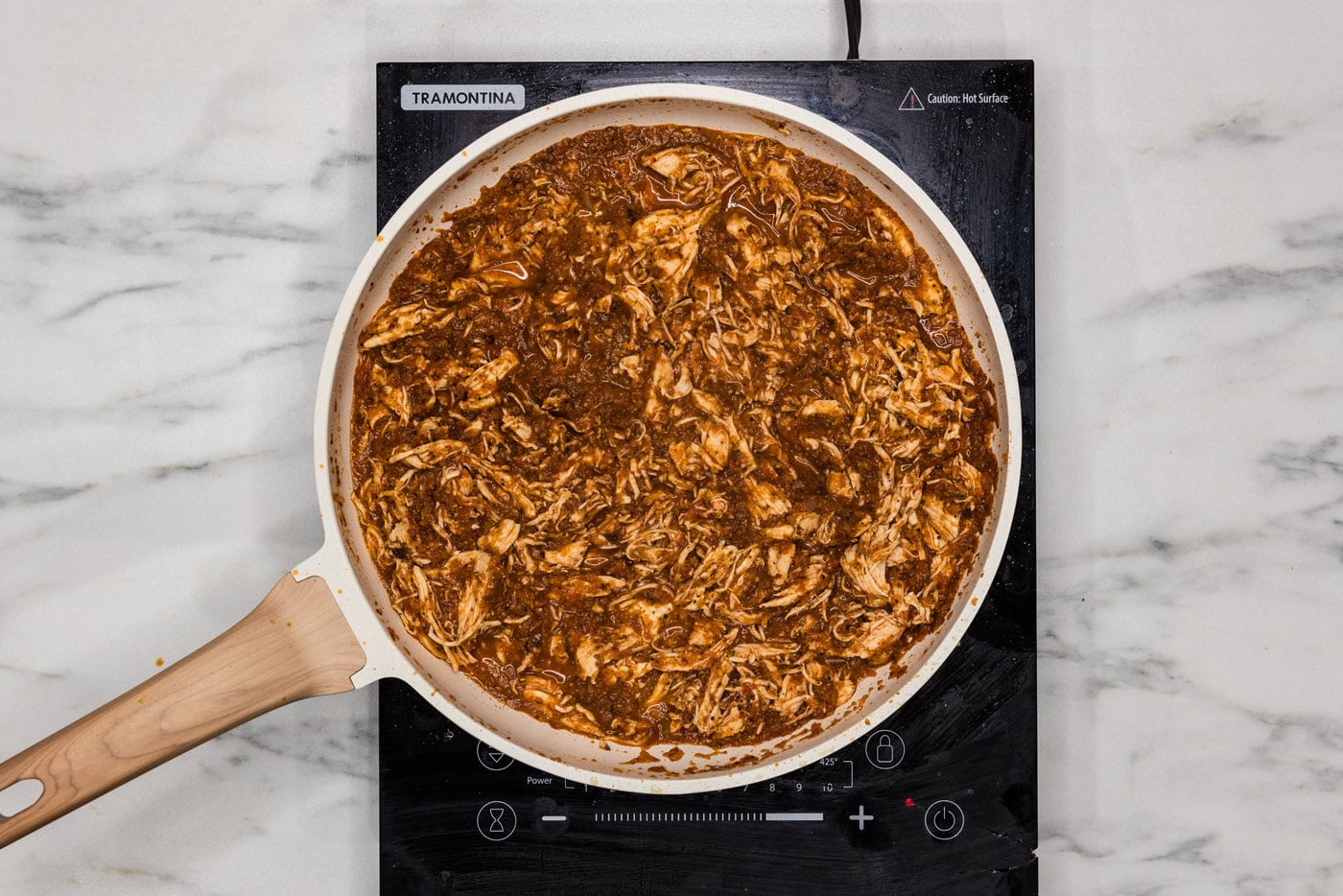 overhead of chicken tinga on the stovetop