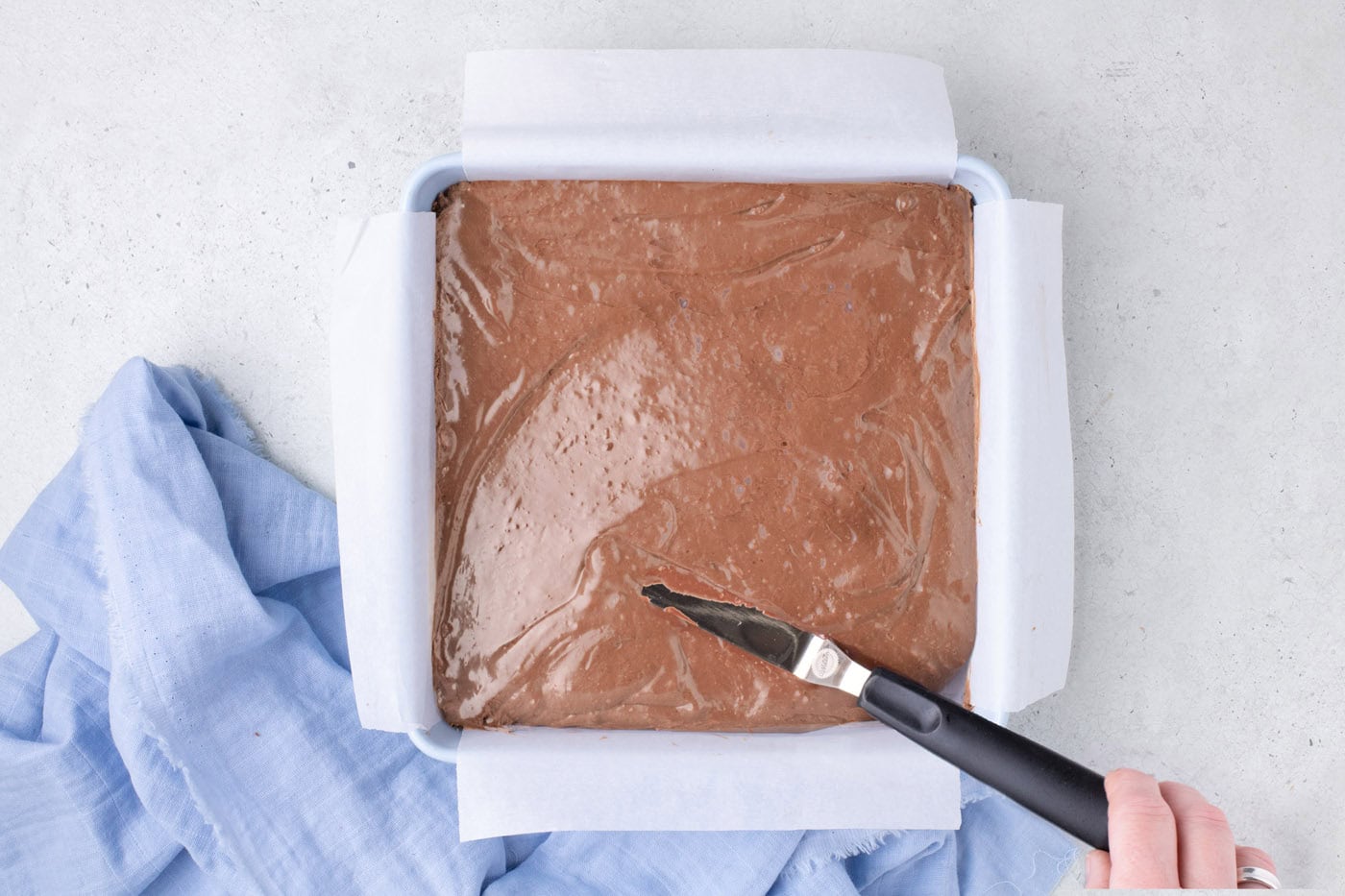 whipped chocolate mixture added to baking pan