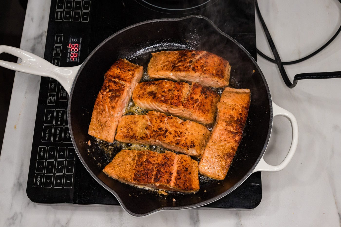 pan seared salmon in a skillet