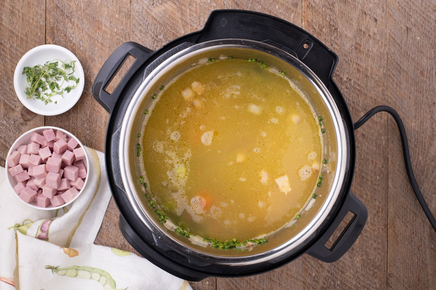 chicken stock added to split pea mixture in instant pot