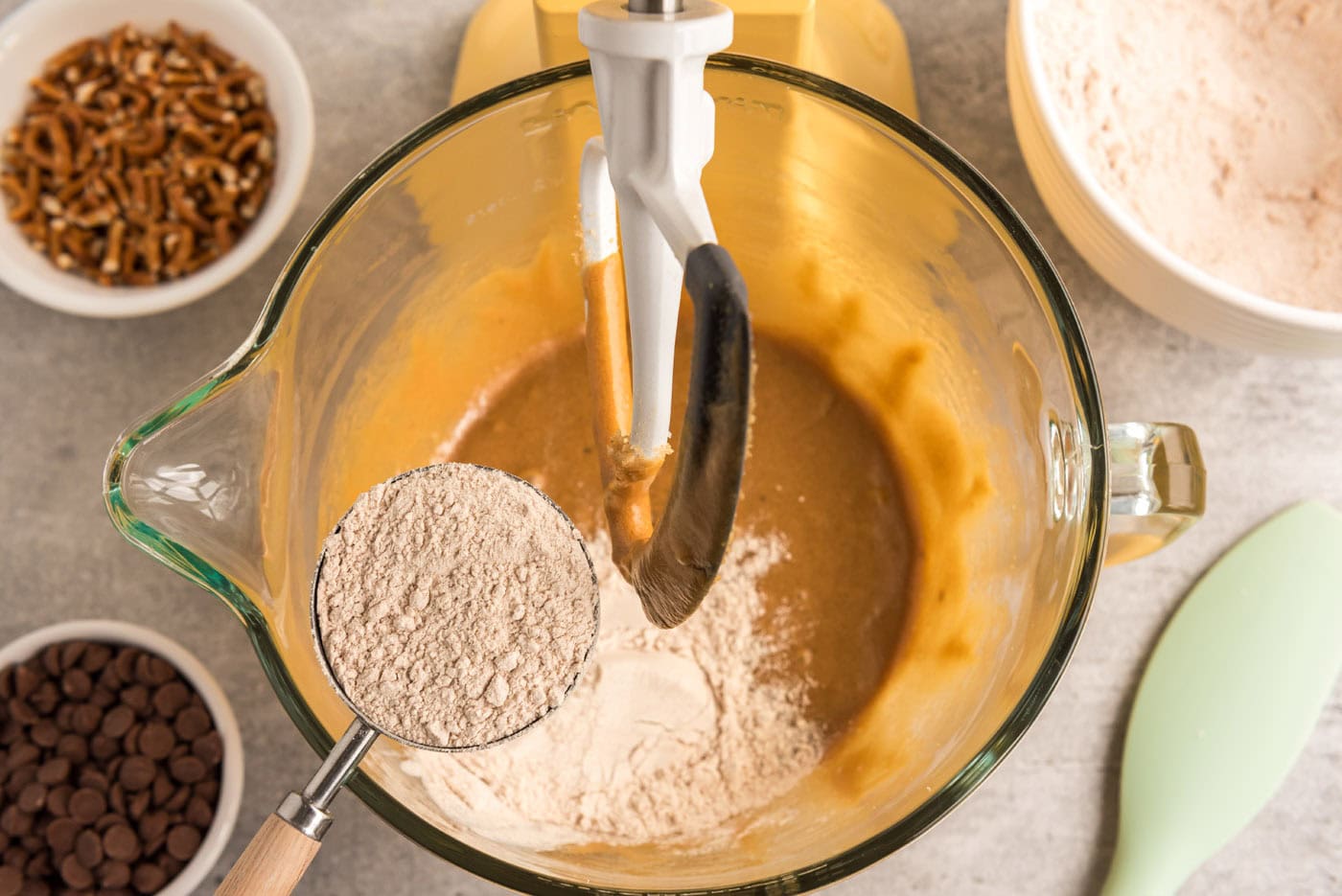 adding a small amount of dry ingredients to wet ingredients for cookies