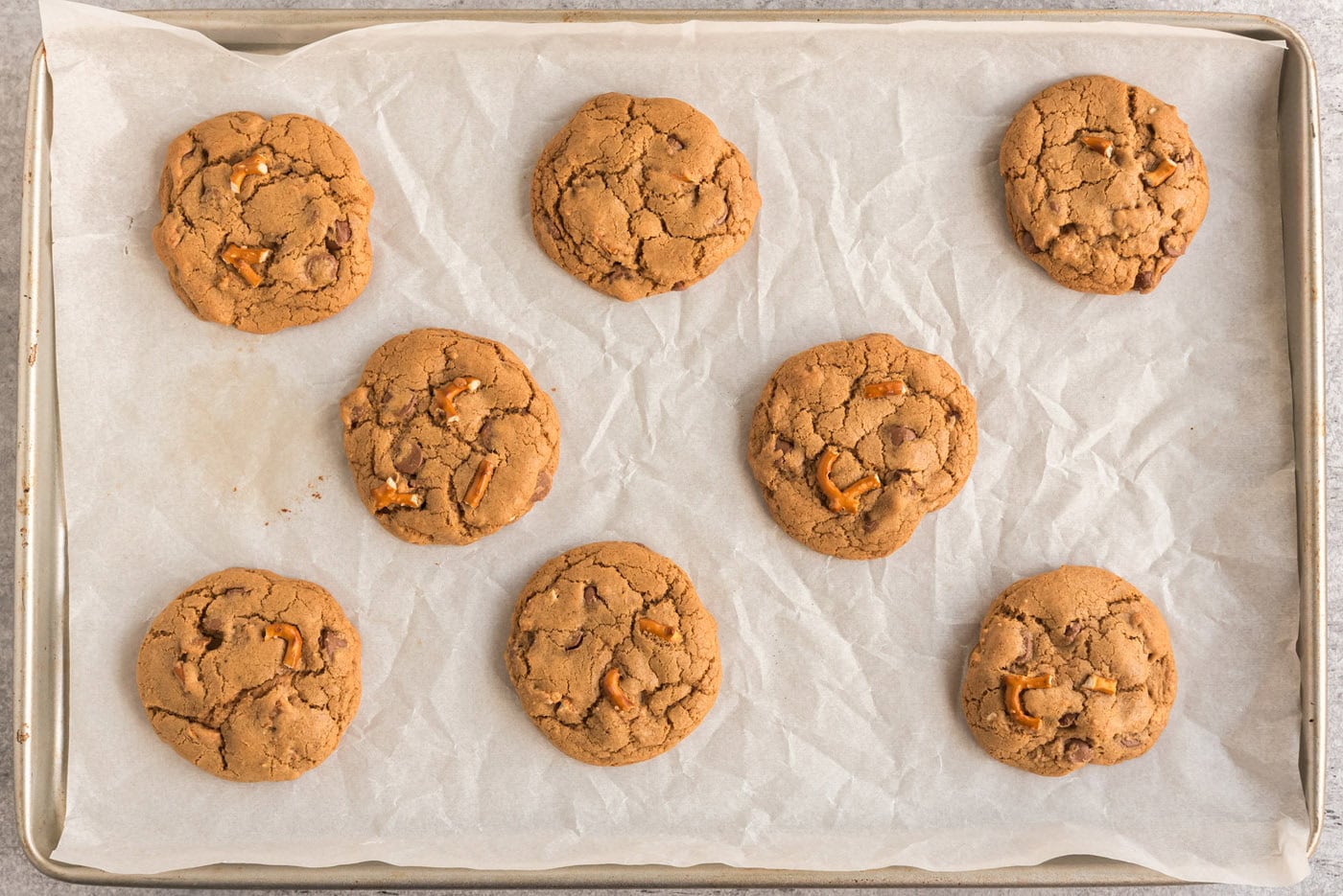 overhead of baked chocolate chip pretzel cookies