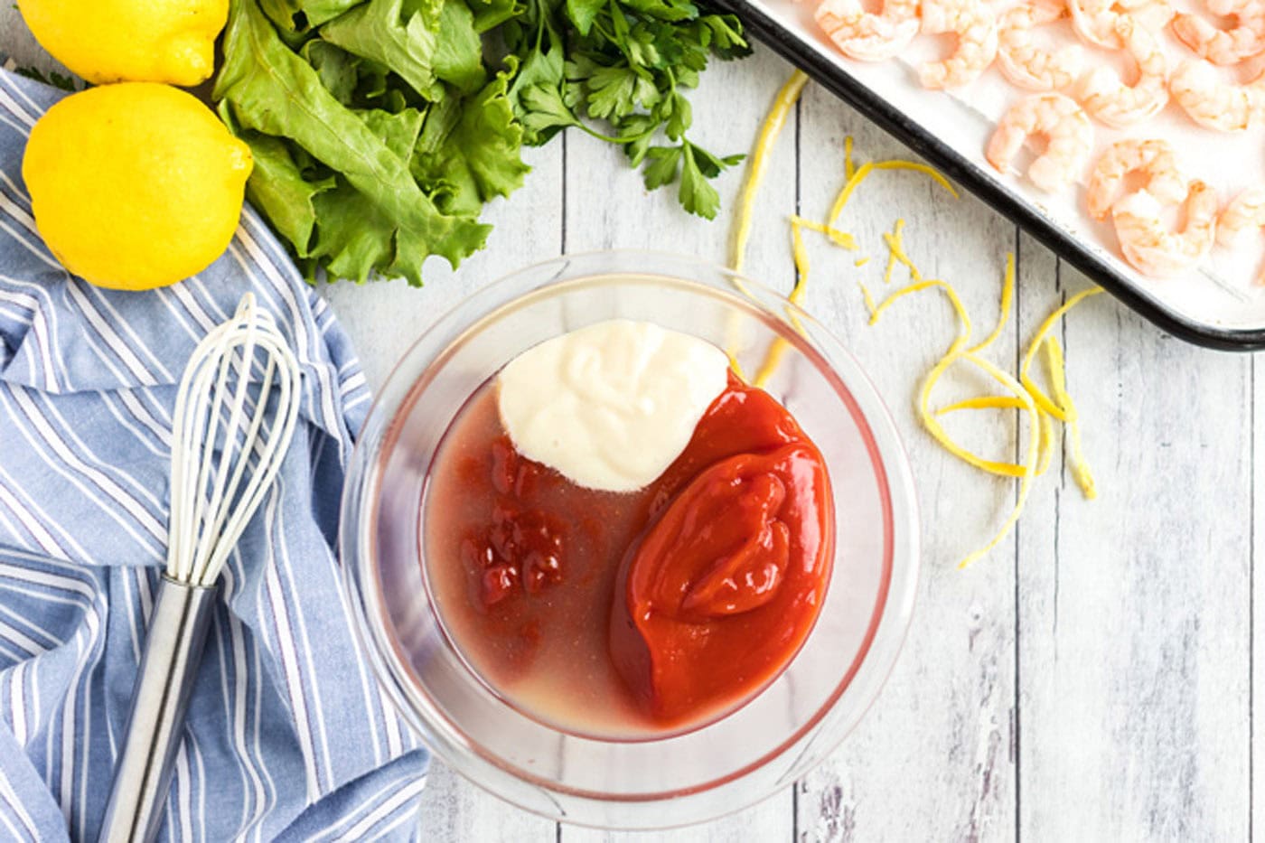 Chili sauce, ketchup, horseradish and lemon juice in a bowl