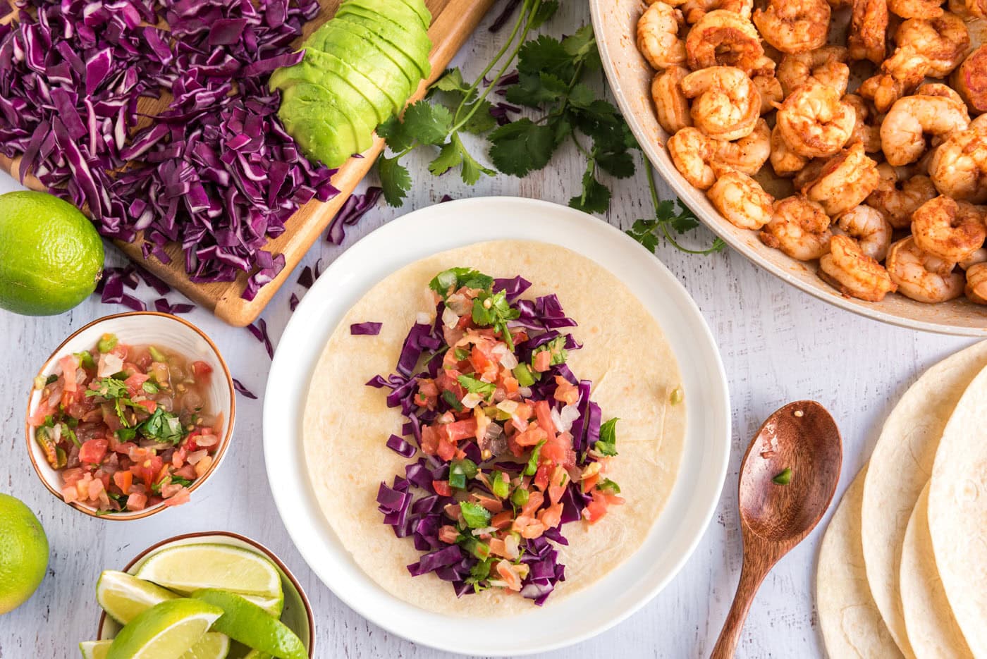 tortilla with cabbage, avocado, and fresh salsa