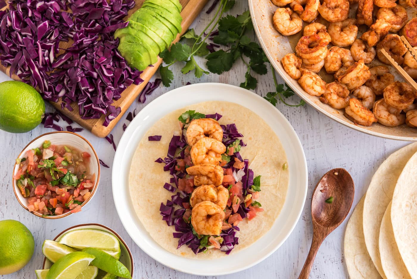 shrimp tacos with cabbage, avocado, and fresh salsa