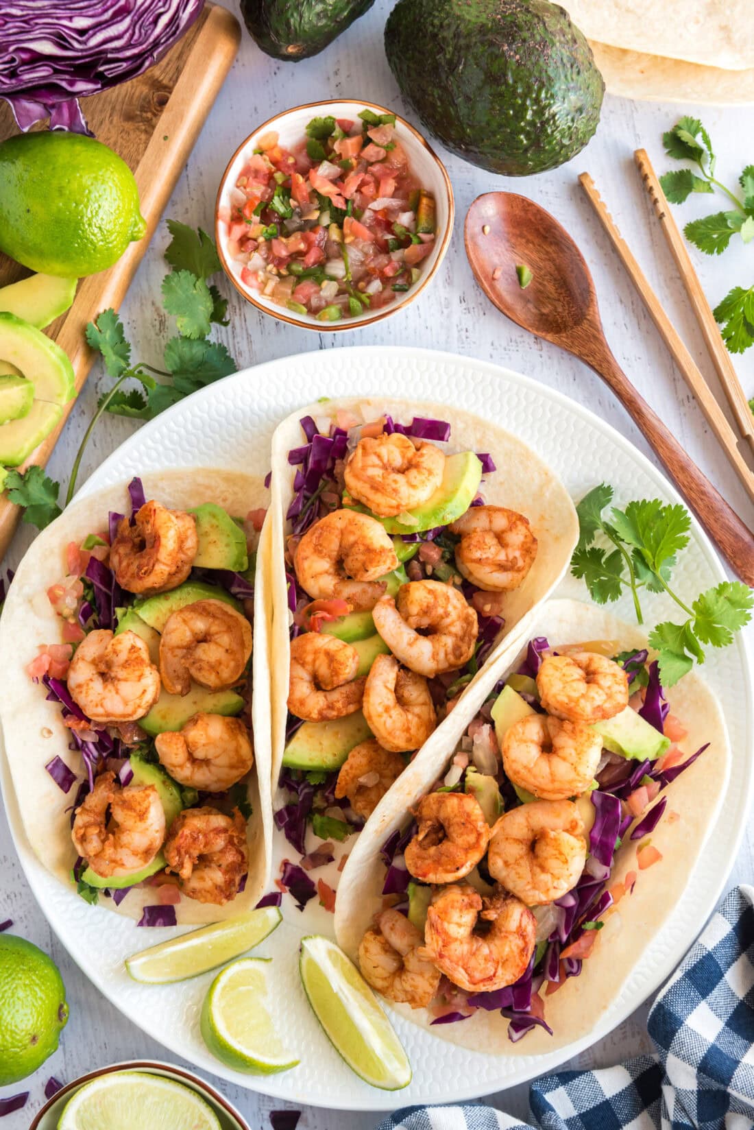 Three Shrimp Tacos on a white plate