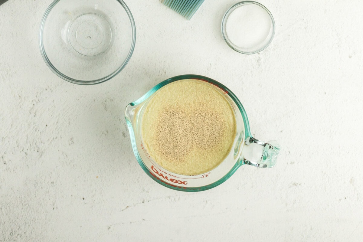 Yeast added to a liquid measuring cup of water