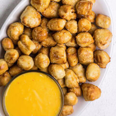 Platter of Air Fryer Pretzel Bites with a bowl of cheese to the side