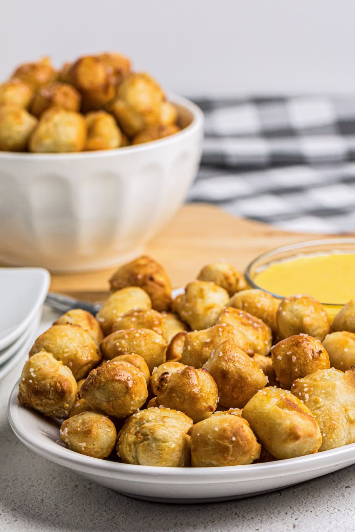 Plate of Air Fryer Pretzel Bites with more in a bowl in the background