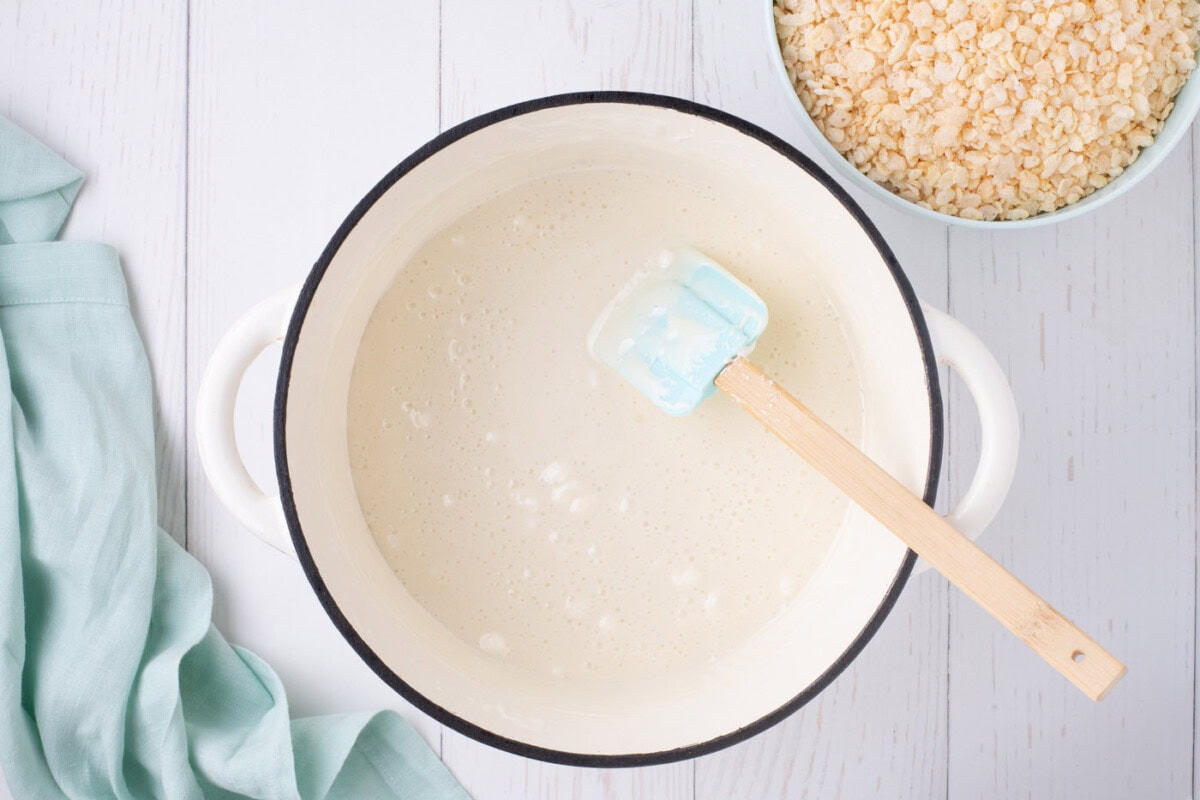 melted marshmallows in a pot with a rubber spatula