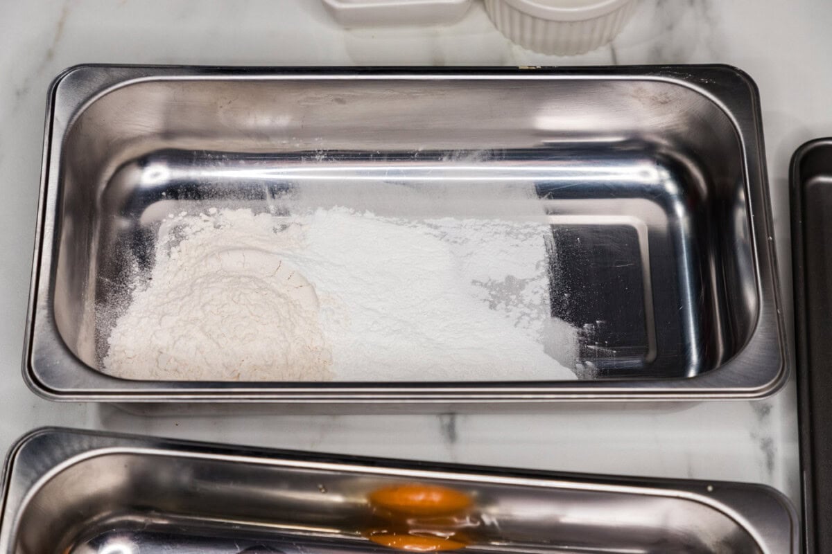 flour in a breading tray