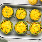Overhead photo of Chili and Cornbread Stuffed Peppers in a pan