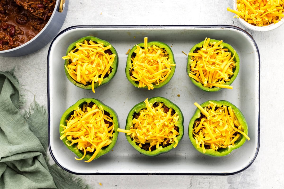 cheese on top of chili stuffed peppers