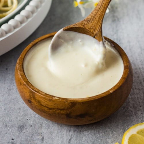 Bowl of Lemon Cream Sauce with a spoon in it