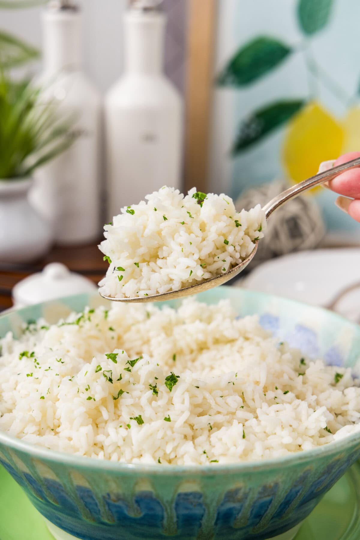 Spoonful of Pasta Method Rice held above a bowl of Pasta Method Rice