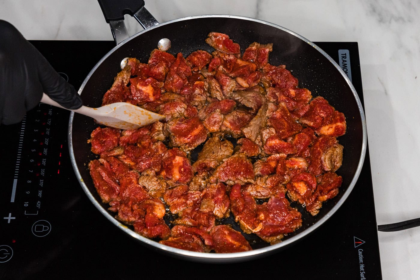 cooking steak in a skillet