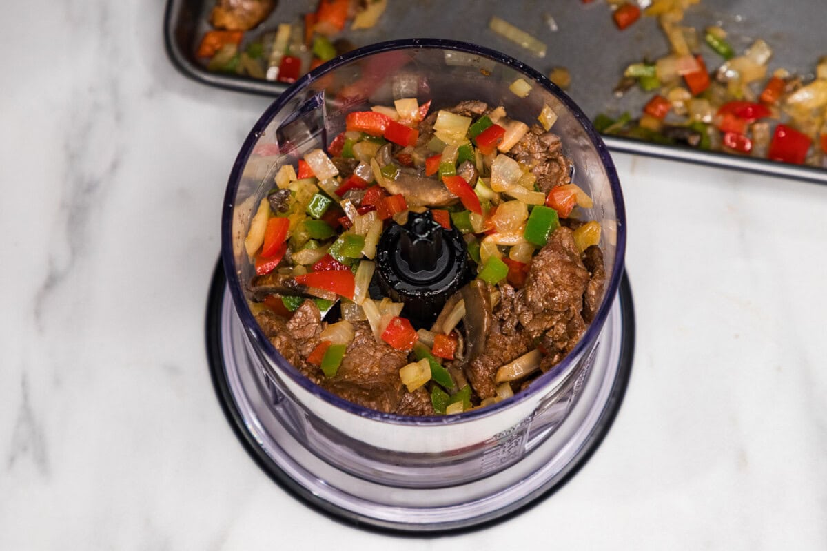 veggies and meat mixture in a food chopper