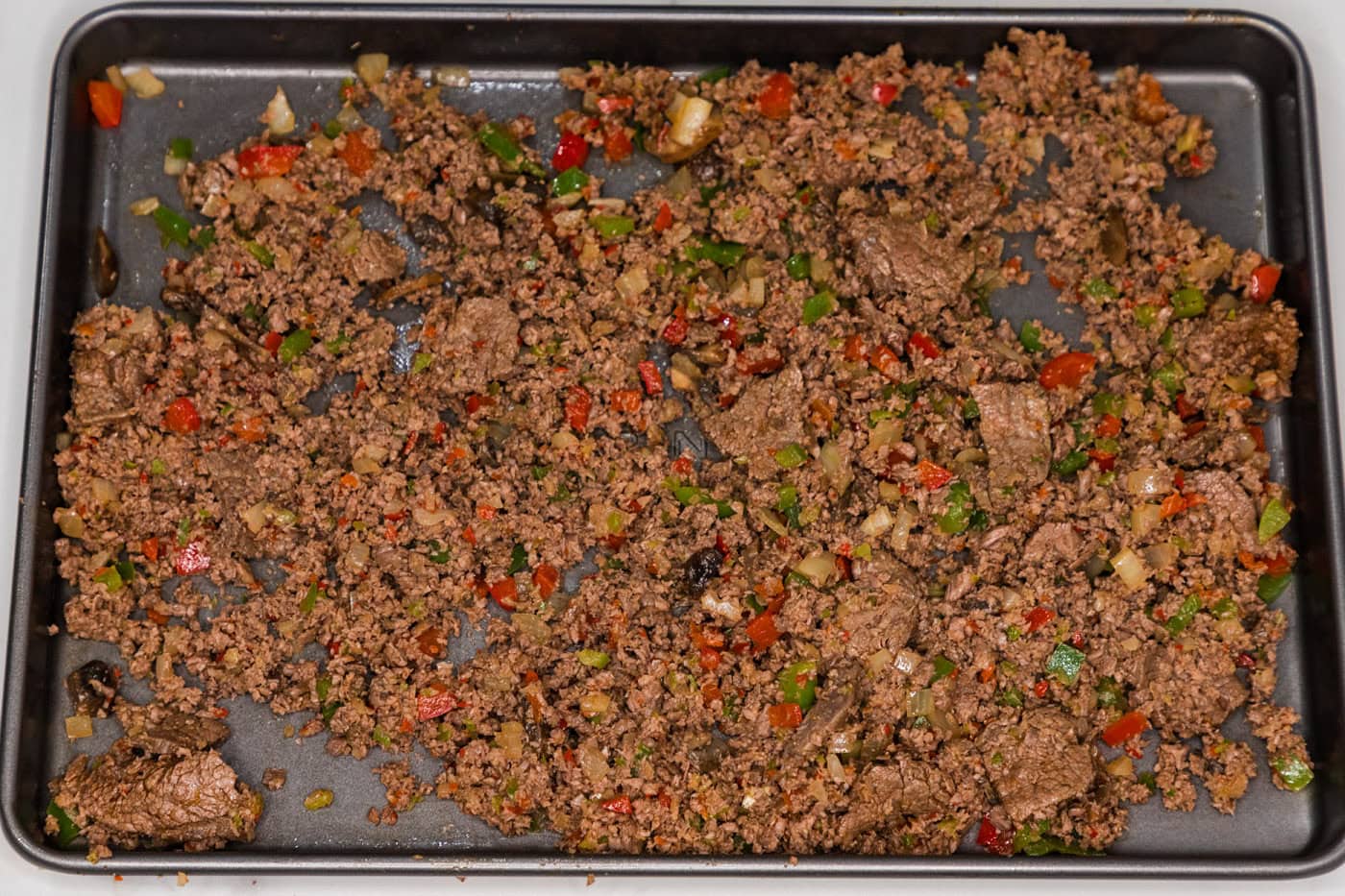 meat mixture on a baking sheet