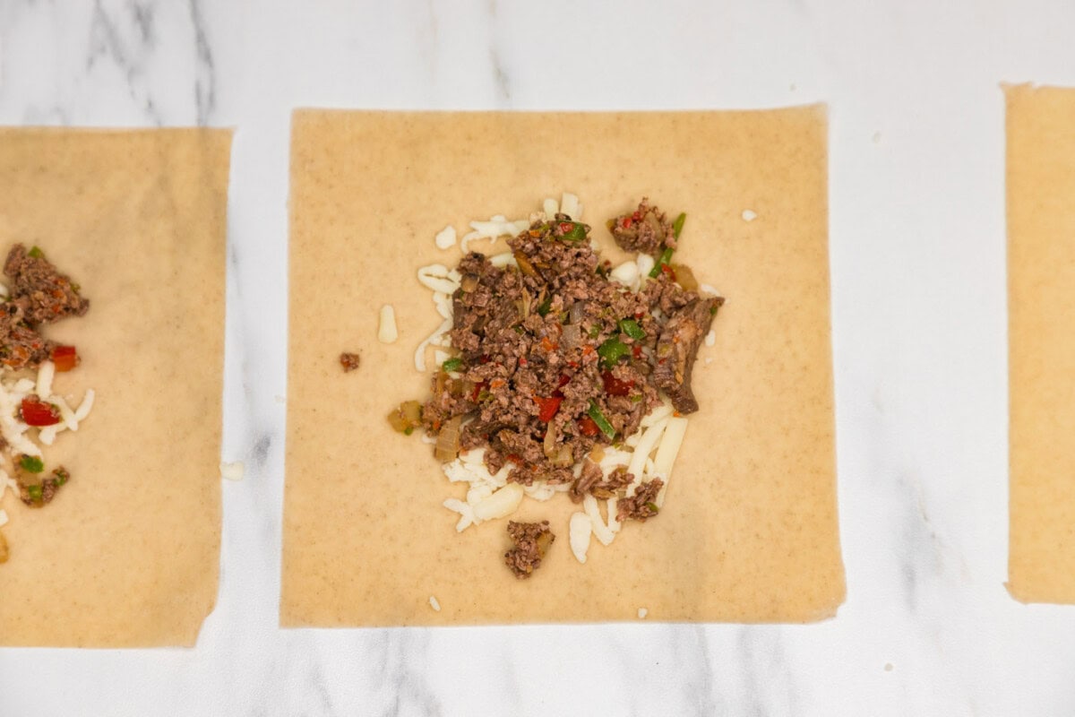 meat mixture on top of egg roll wrapper