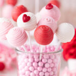 Valentine Cake Pops resting in a glass container