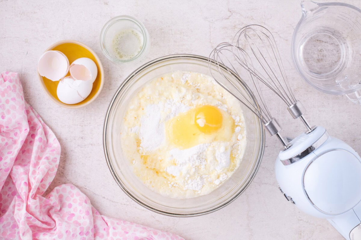 cake mix with butter, eggs, and water in a bowl
