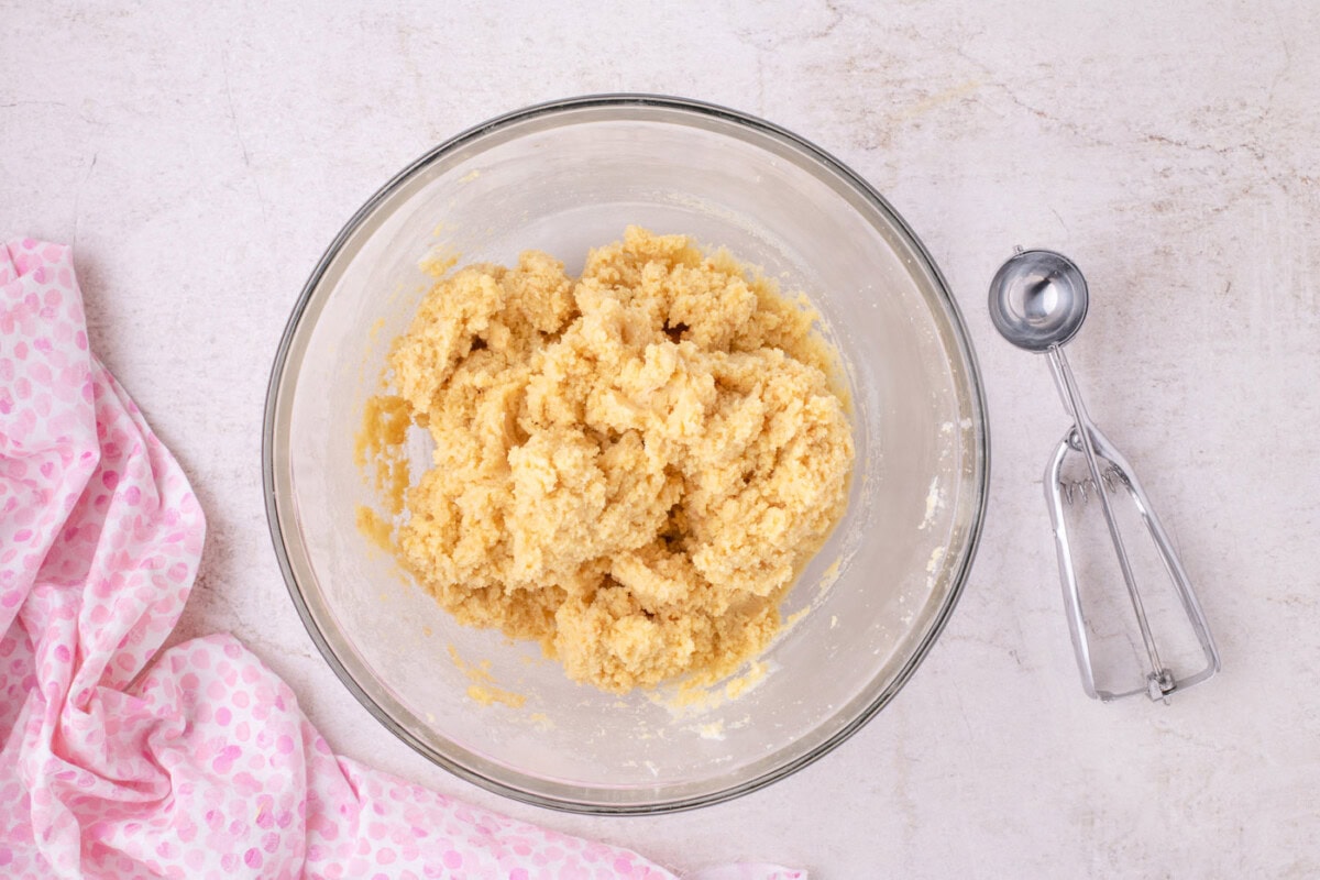 crumbled cake with frosting in a bowl