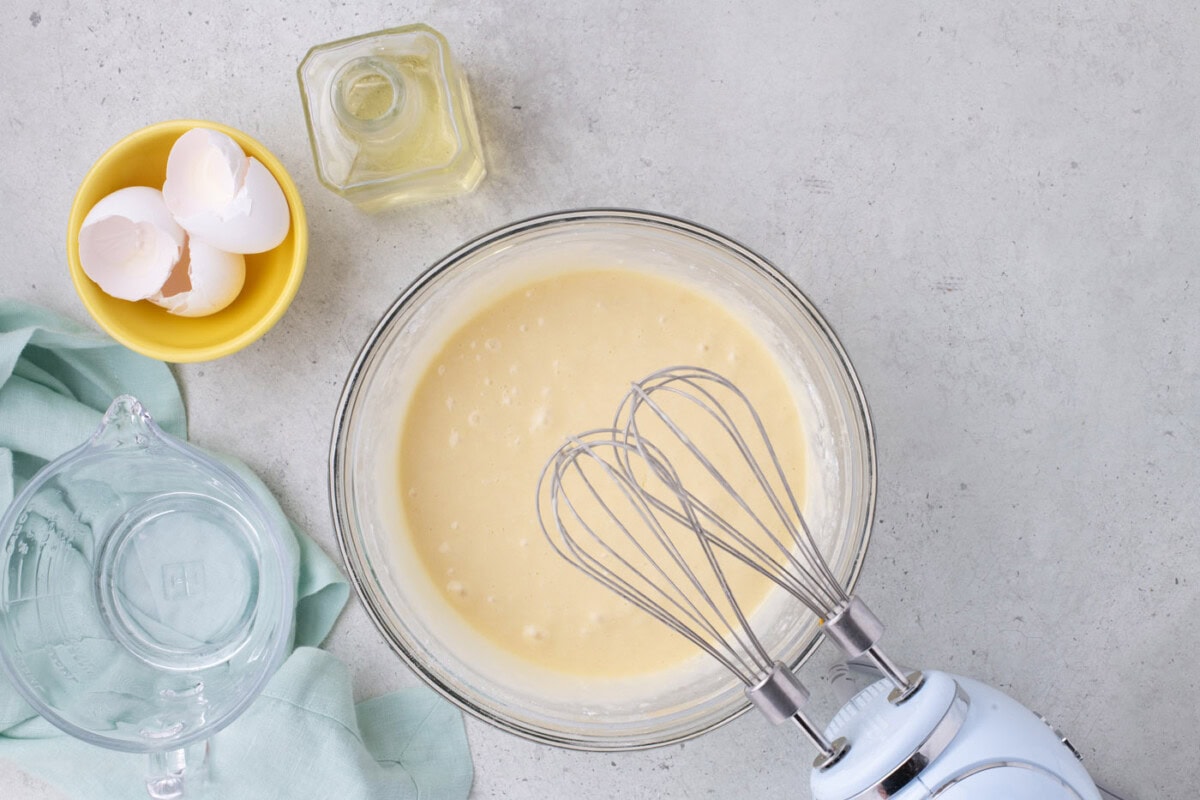 cake batter mixed in a bowl with a hand mixer