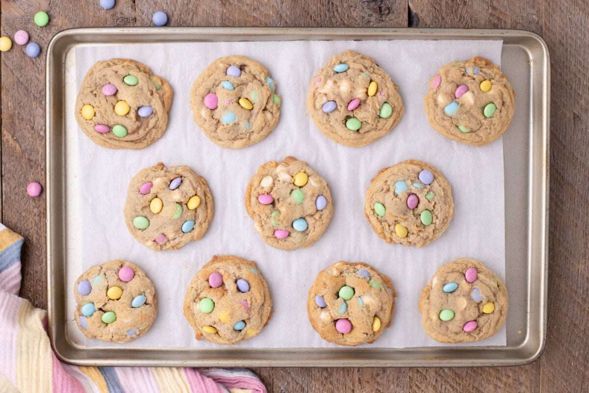 overhead of Easter M&M cookies on a baking sheet
