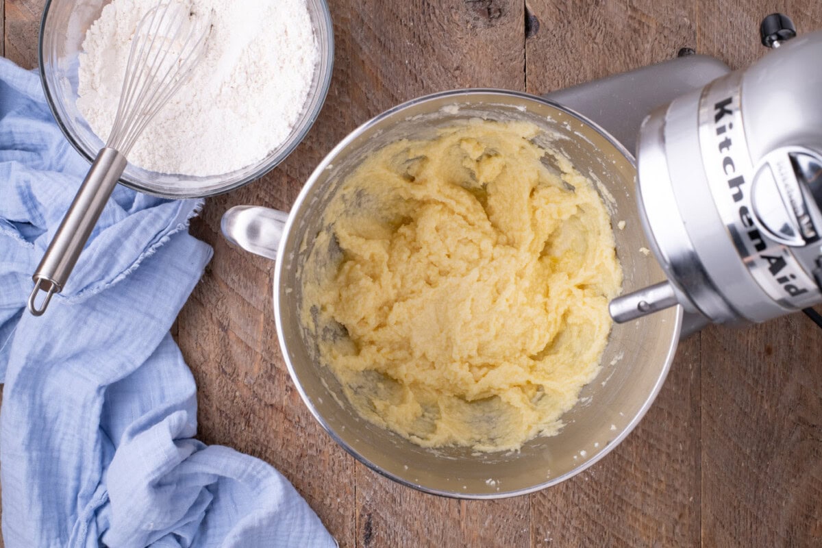 butter, eggs, and sugar mixture in a stand mixer bowl