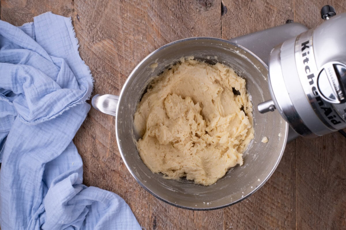 lemon cake batter mixture in a stand mixer bowl