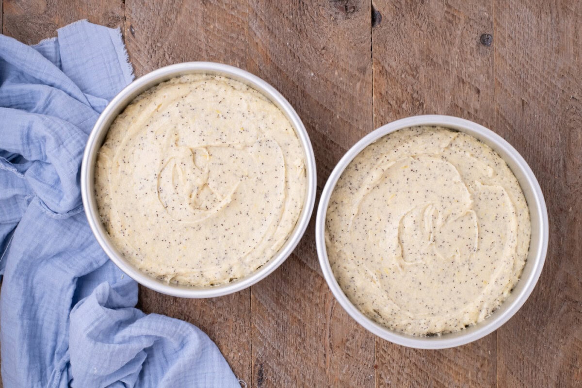 lemon poppy seed cake batter in cake pans