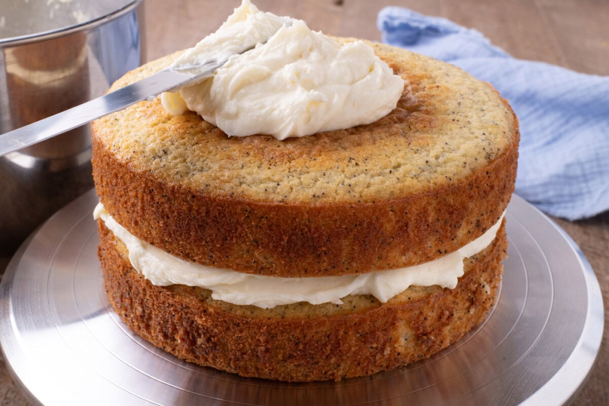 spreading lemon cream cheese frosting on cake rounds