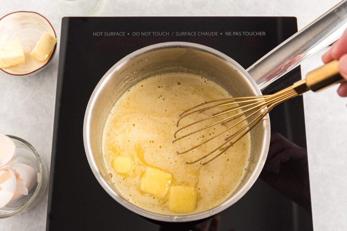 whisking butter into egg and buttermilk mixture