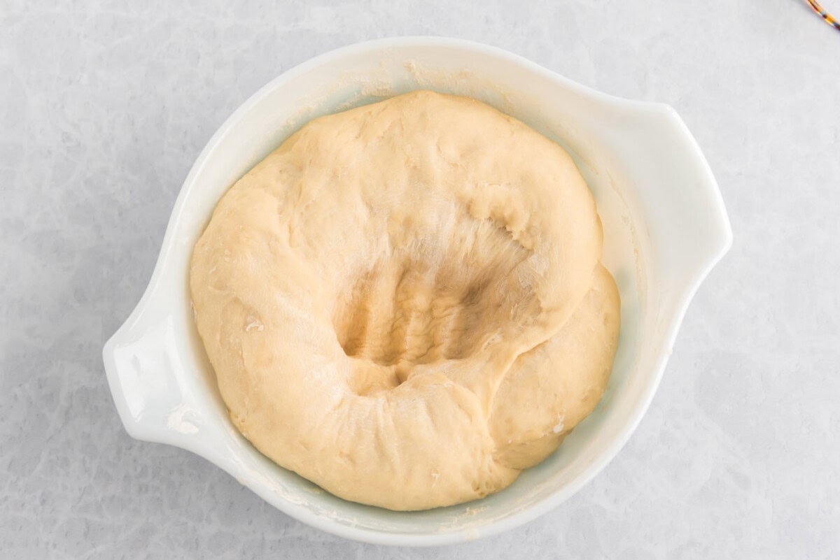 dough with a punch mark in a bowl