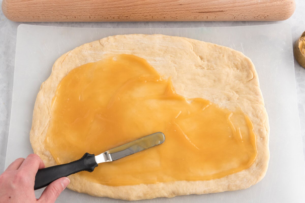 lemon curd spread over dough