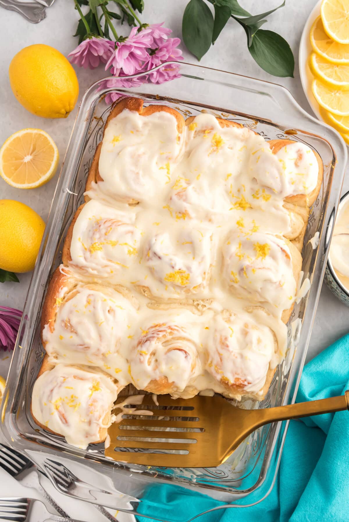 Pan of Lemon Sweet Rolls with a spatula in it
