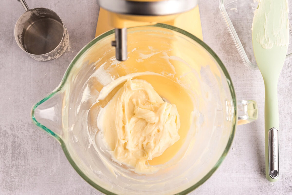 cream cheese, powdered sugar, and peppermint extract beaten in a bowl of a mixer