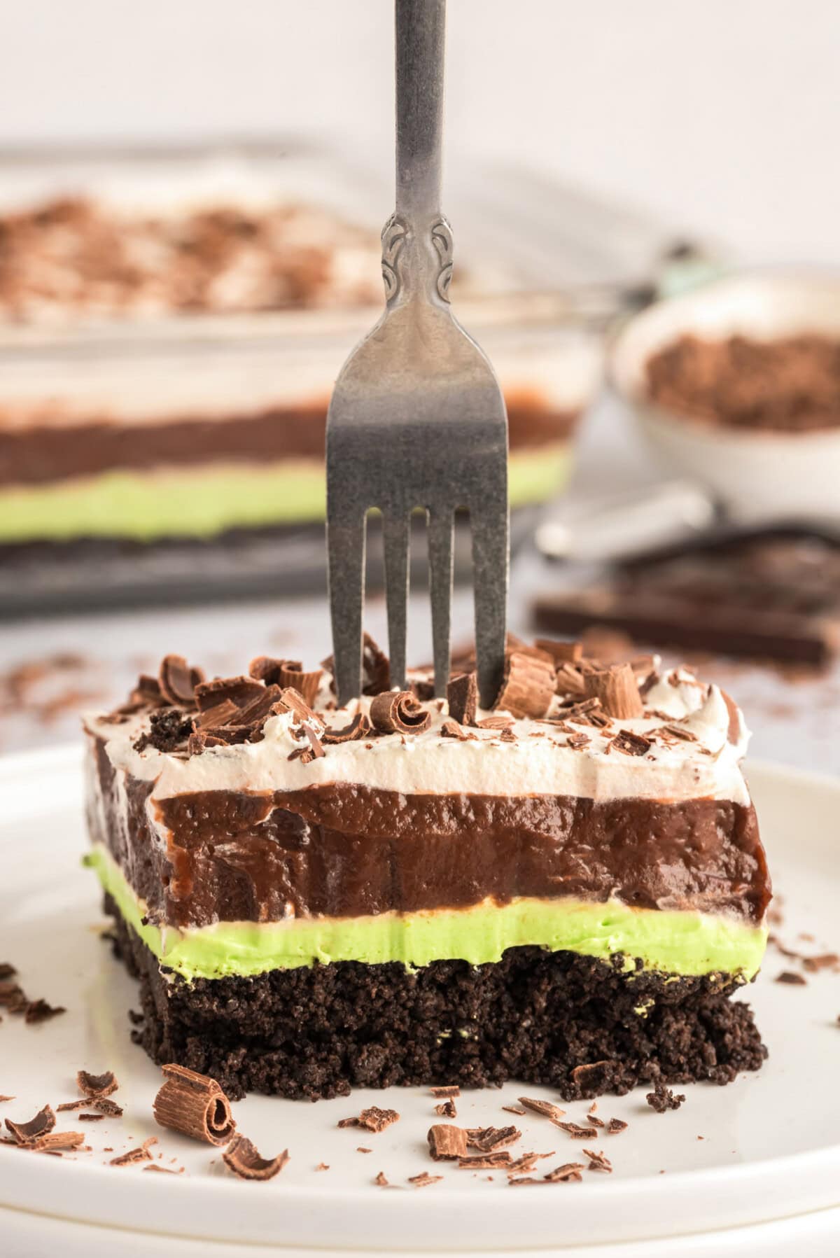 Fork stuck in a slice of Mint Chocolate Lasagna