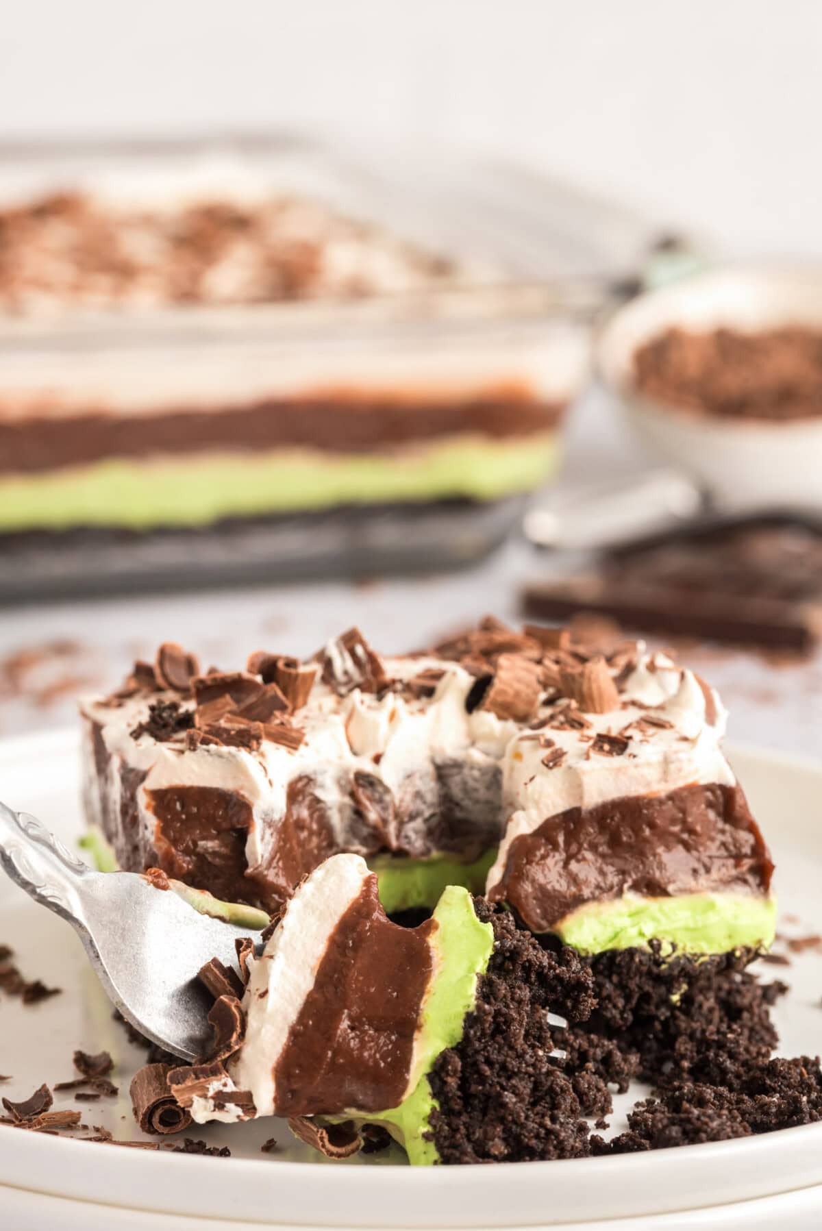 Fork breaking apart a piece of Mint Chocolate Lasagna