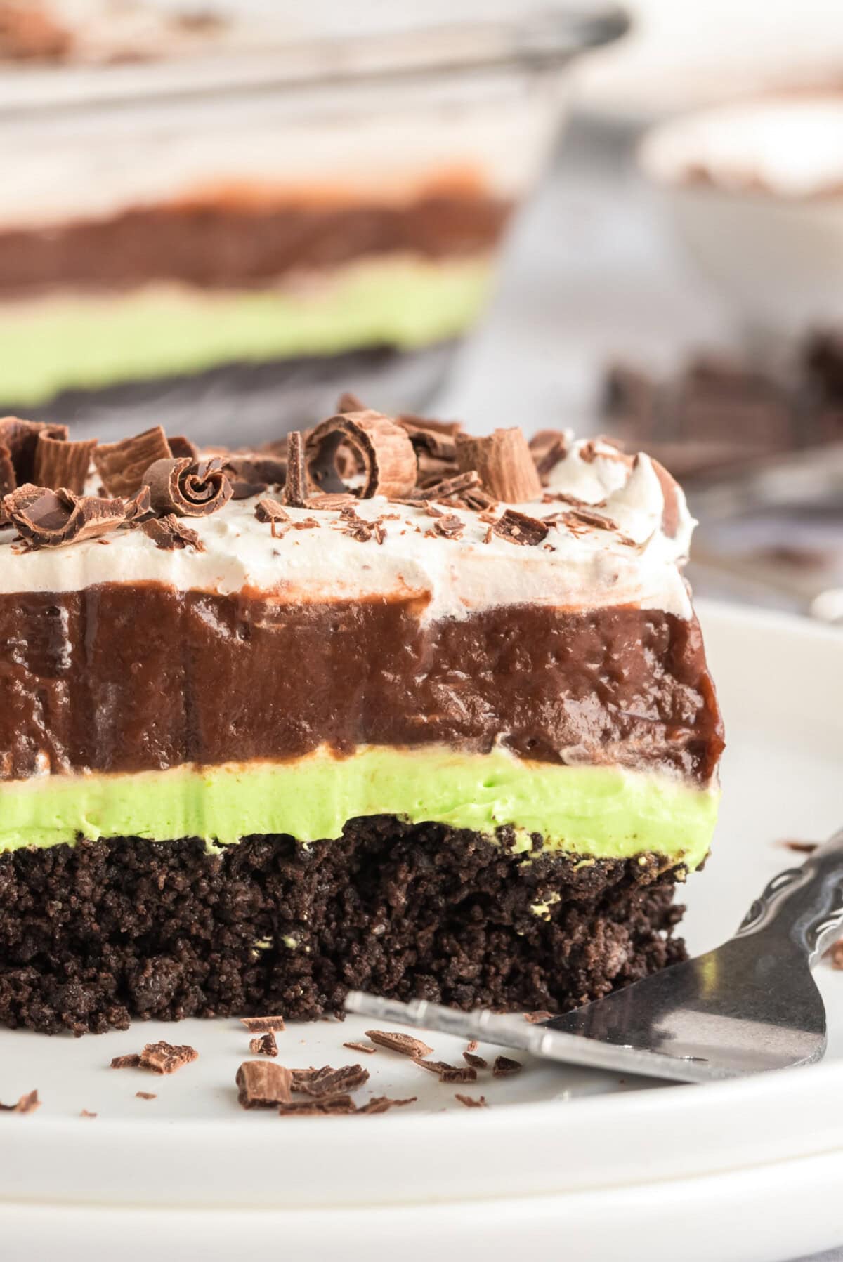 Close up photo of a slice of Mint Chocolate Lasagna