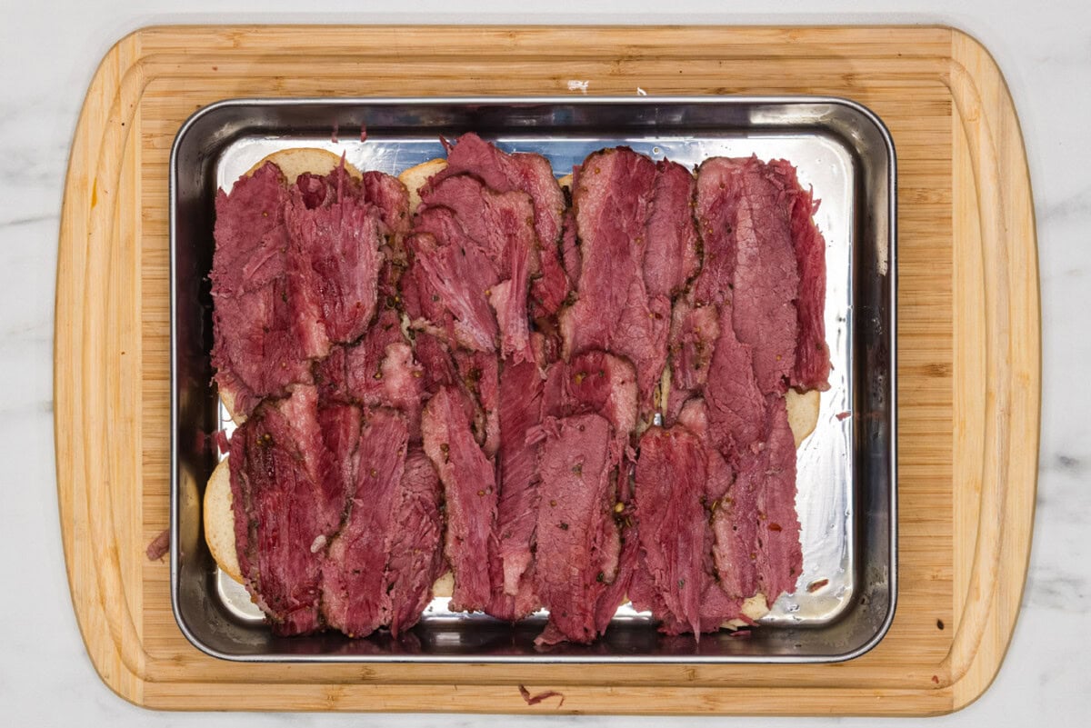 corned beef layered on top of slider buns