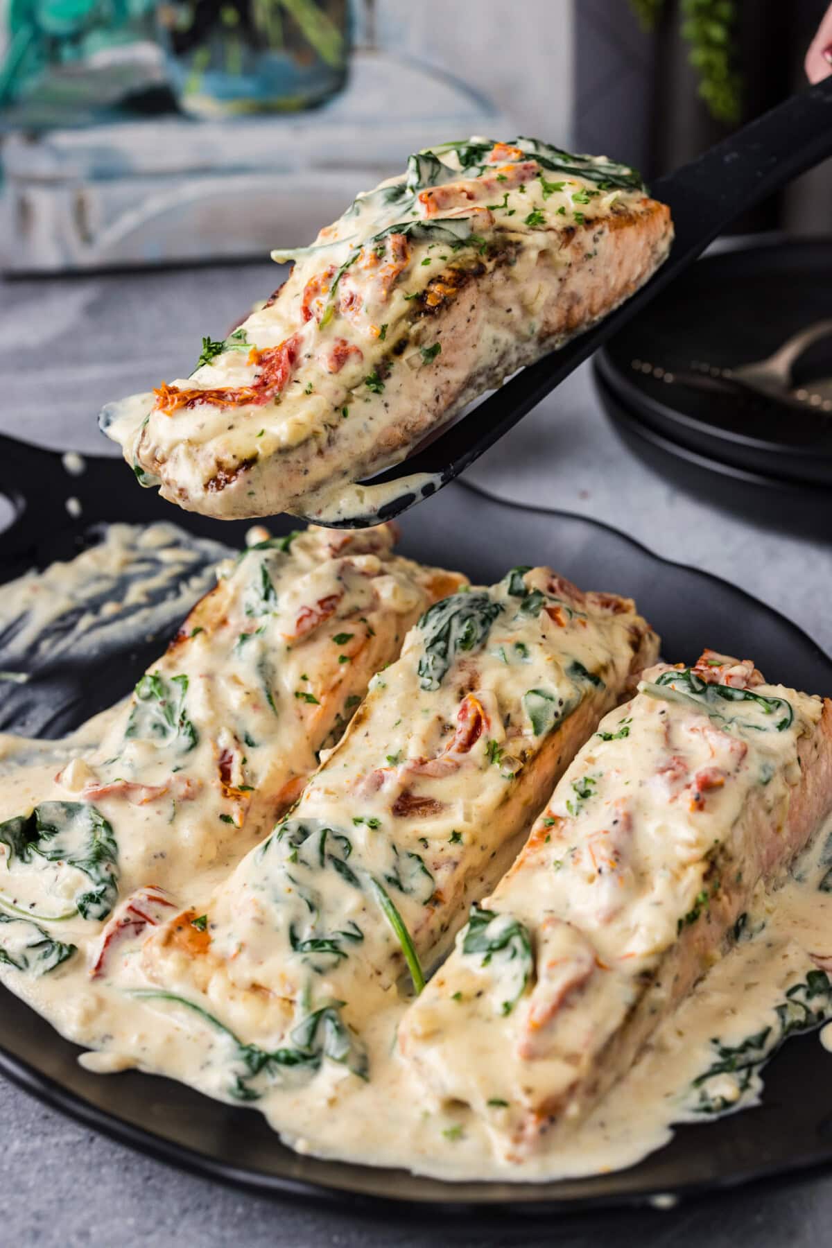 Spatula lifting up a Tuscan Salmon filet 
