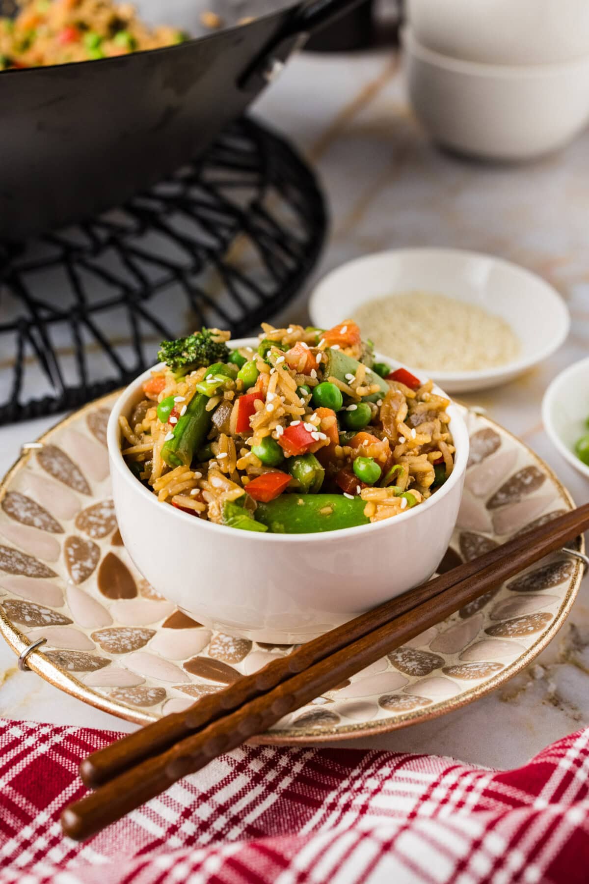 Bowl of Vegetable Fried Rice with chopsticks on the side