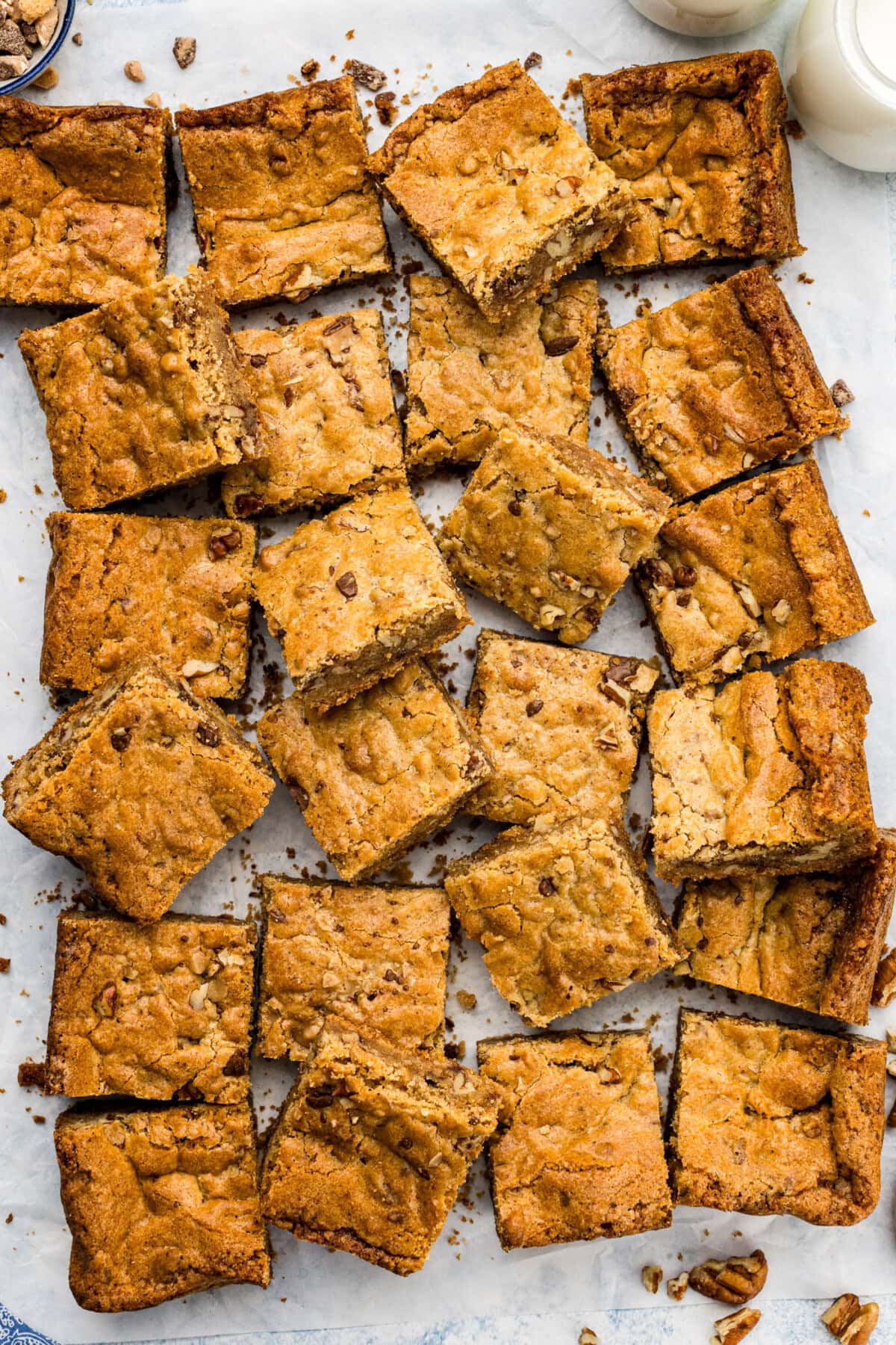 Brown Butter Chocolate Toffee Blondies cut up on parchment paper