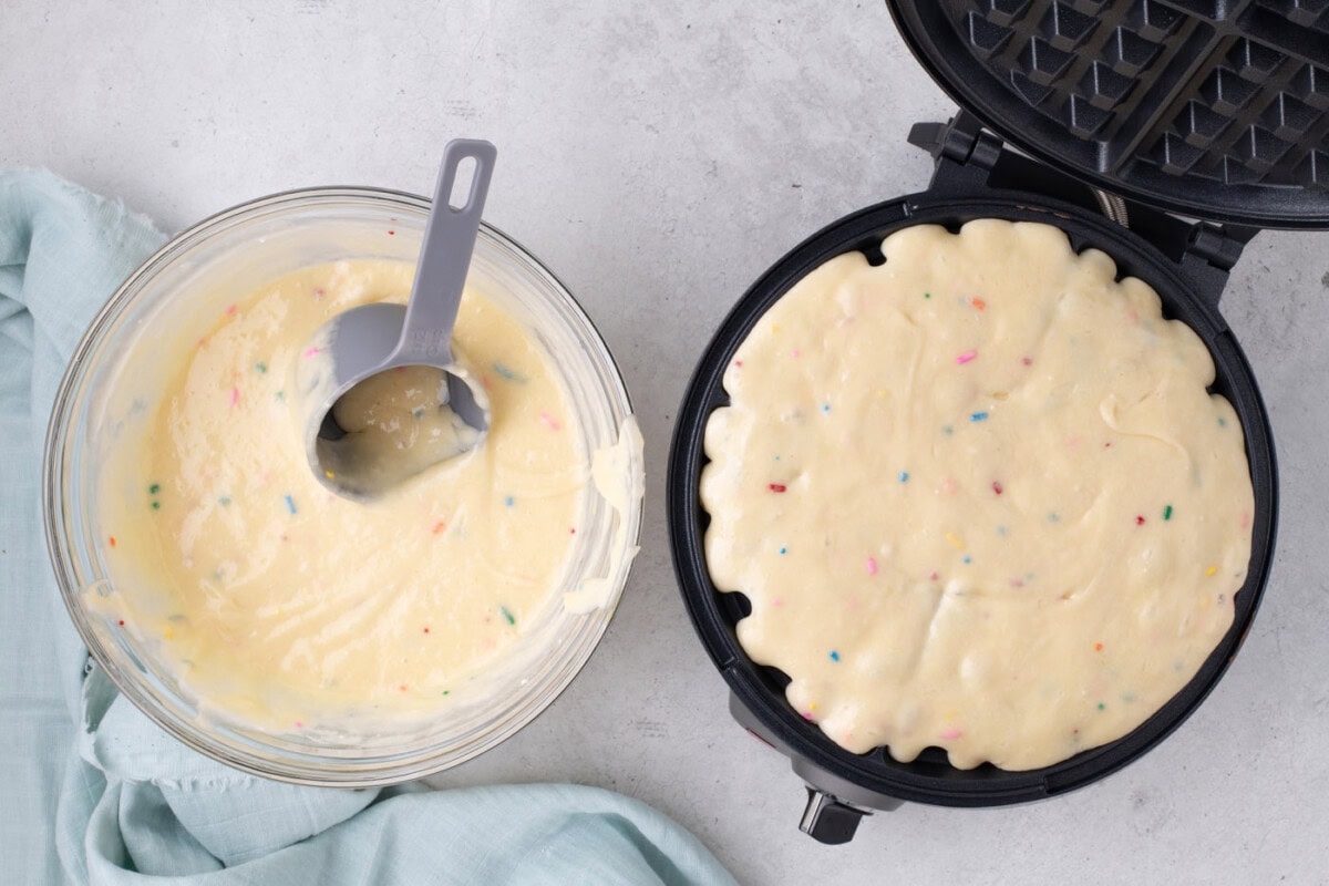 cake mix batter in a waffle iron