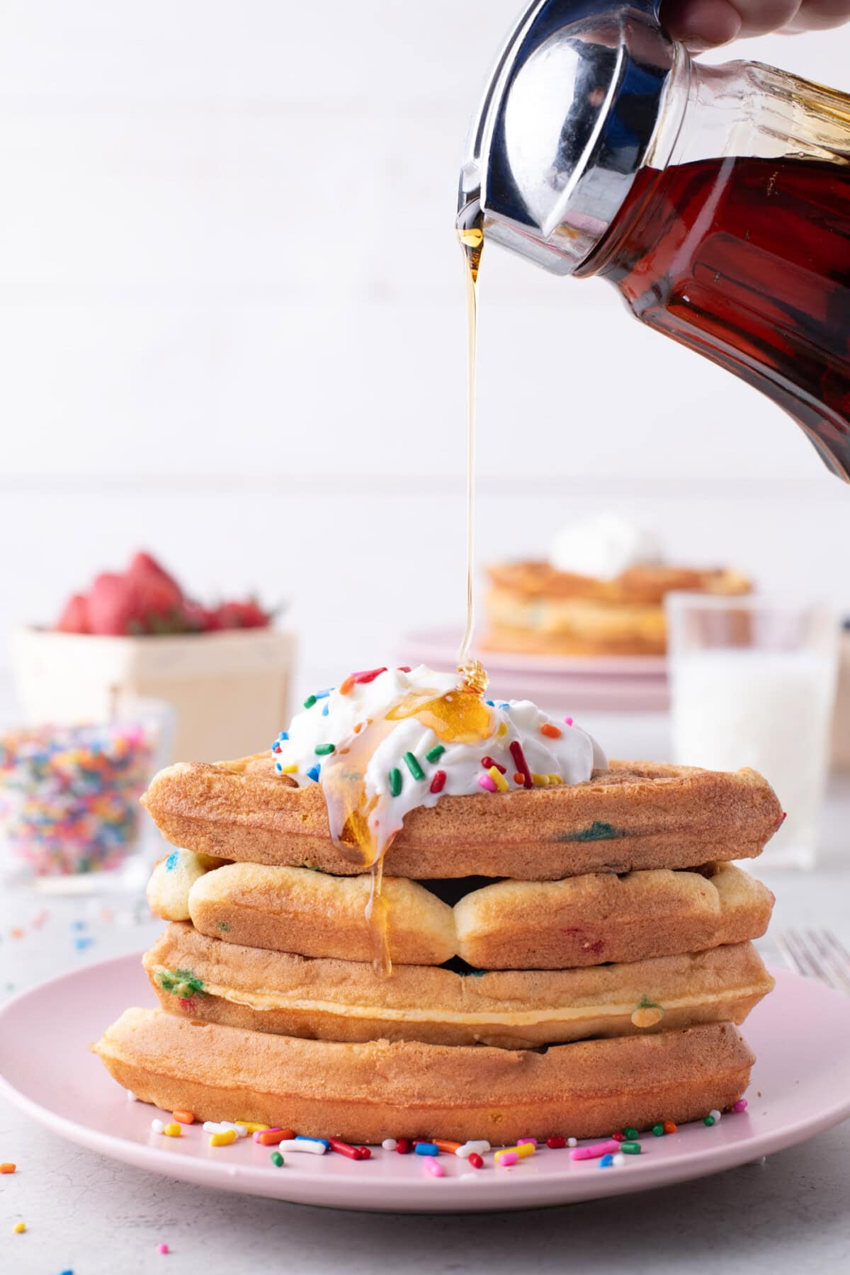 Syrup being poured onto Cake Mix Waffles